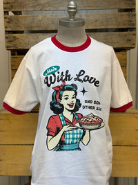 Thumbnail for A vintage-style white ringer t-shirt displayed on a mannequin torso against a rustic wooden crate background. The shirt features red ribbed collar and cuffs, and a retro graphic of a pin-up girl holding a pie with the text 'Made With Love AND SON OTHER SHI'.
