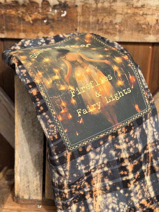 She is made of fireflies and fairy Lights flannel- distressed black