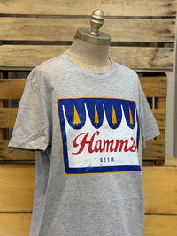 Thumbnail for A heather gray short-sleeve t-shirt displayed on a mannequin torso, featuring a large vintage-style graphic of the Hamm's Beer logo on the chest.